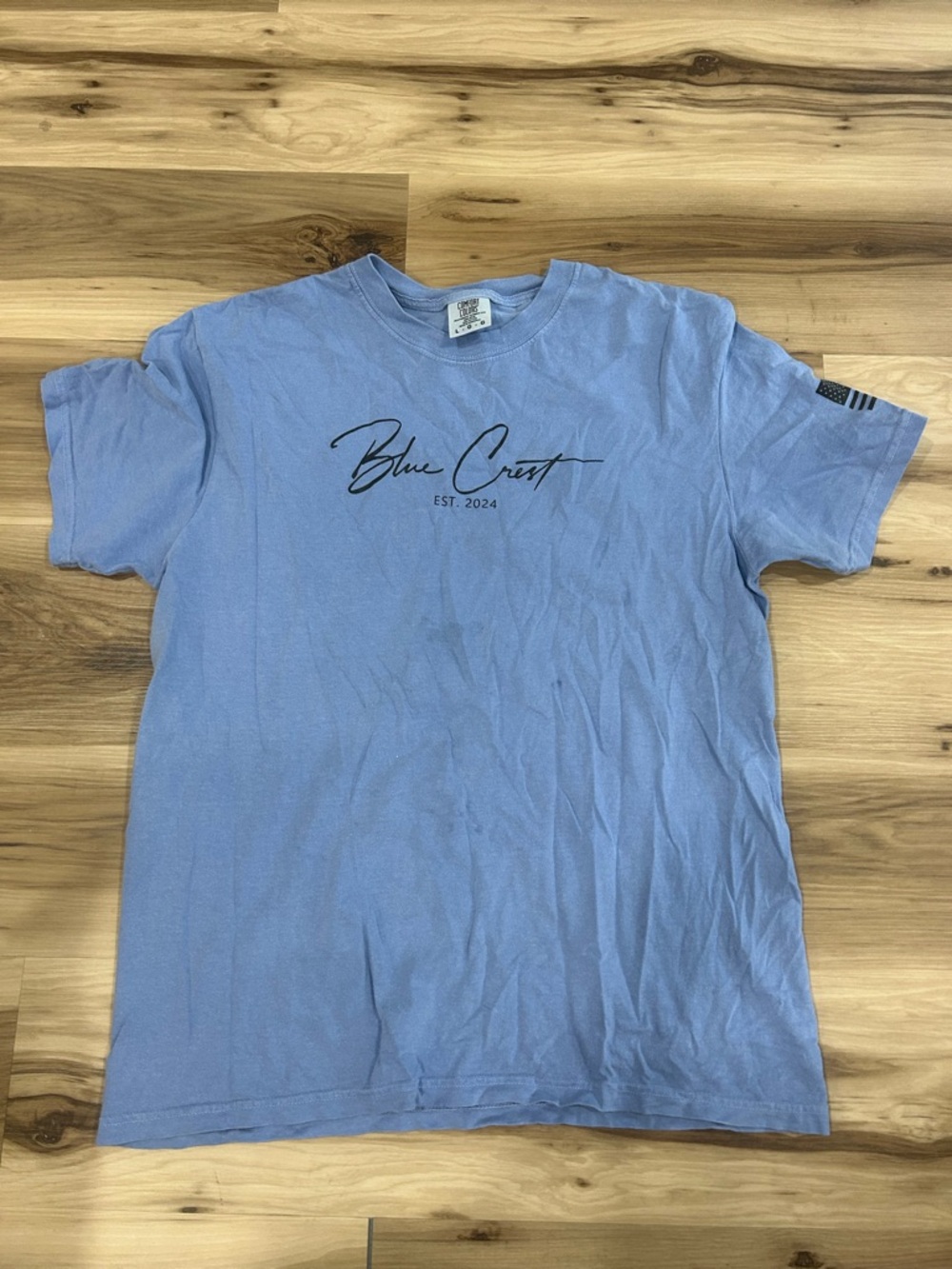 Blue Crest Hopkins Lacrosse Men’s Light Blue Graphic Tee